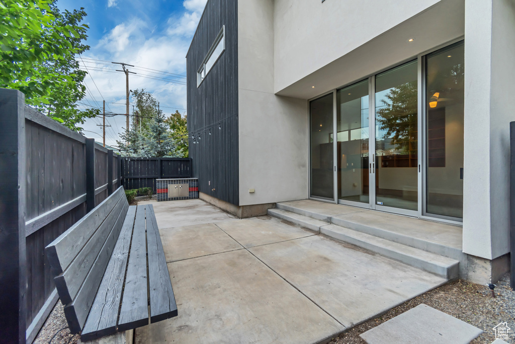 View of patio with a fenced backyard and french doors