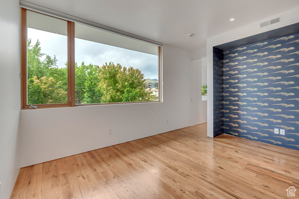 Unfurnished room with wood finished floors