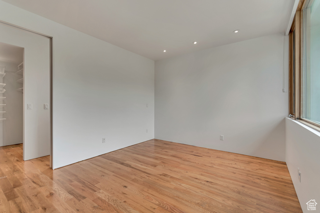 Unfurnished room featuring light wood-type flooring and recessed lighting