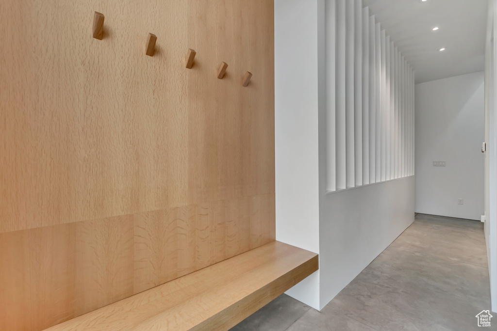 Mudroom featuring finished concrete floors