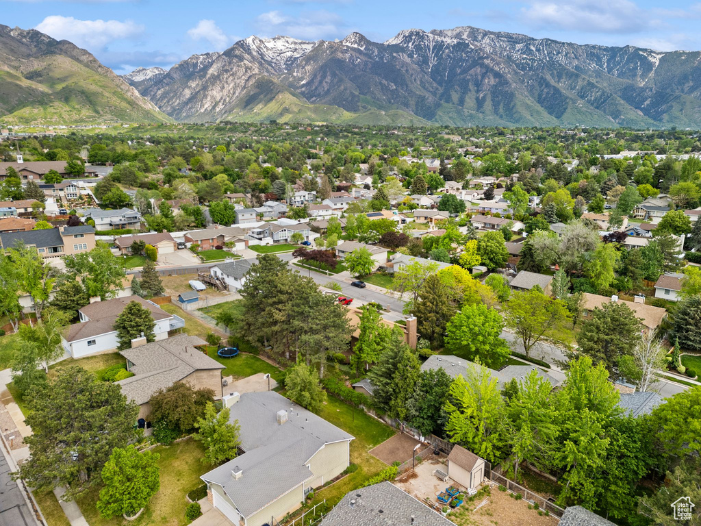 Aerial overview of property\\\'s location featuring nearby suburban area and mountains