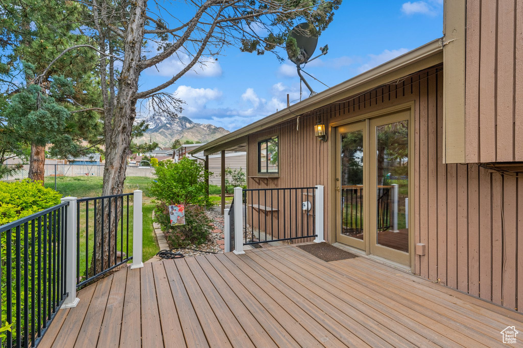 Wooden deck featuring a mountain view