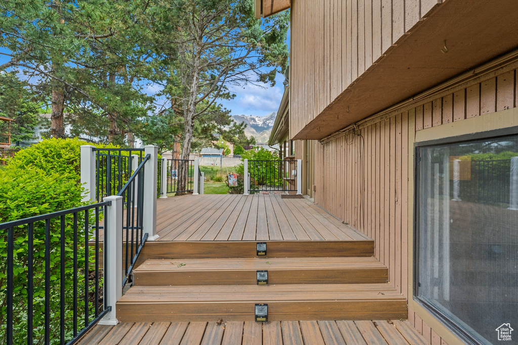 Wooden terrace featuring a mountain view