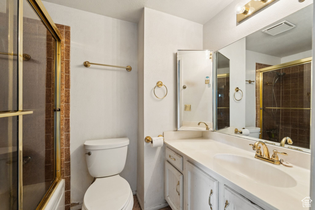 Full bath featuring toilet and vanity