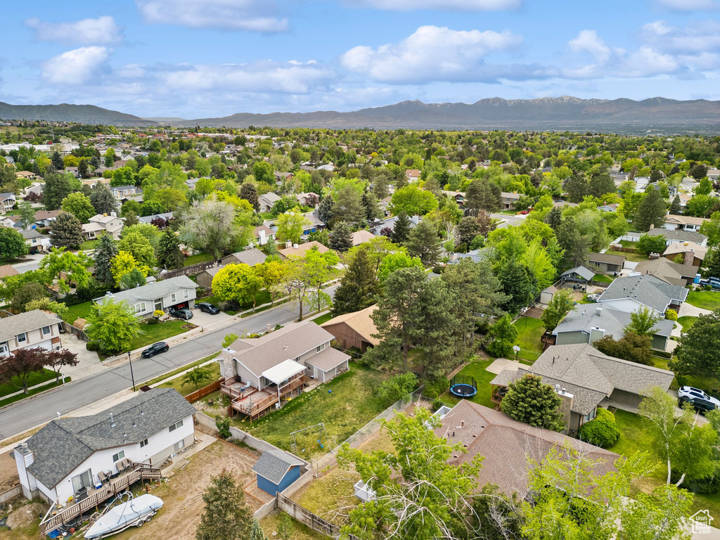 Aerial perspective of suburban area featuring a mountain backdrop