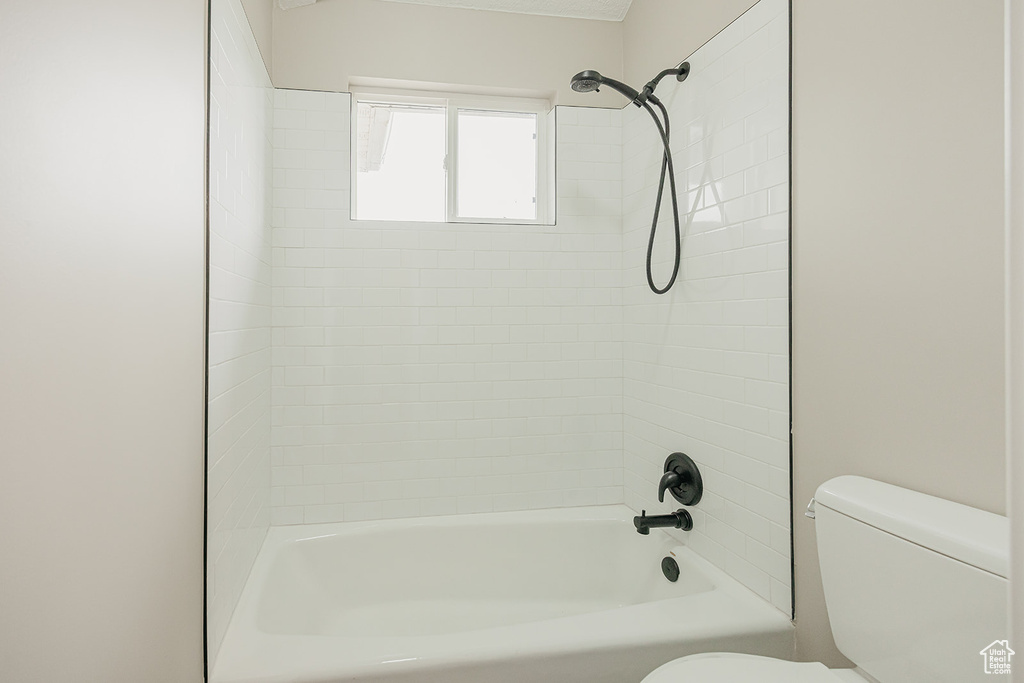 Bathroom with toilet and shower / bath combination