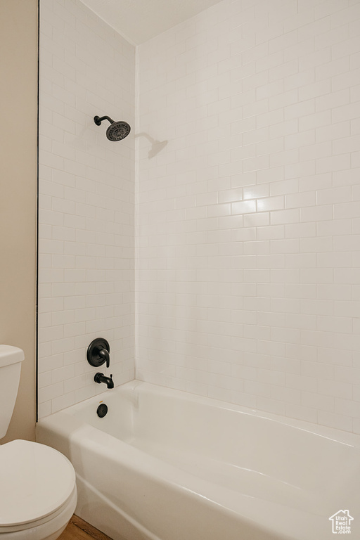 Full bath with toilet and shower / washtub combination