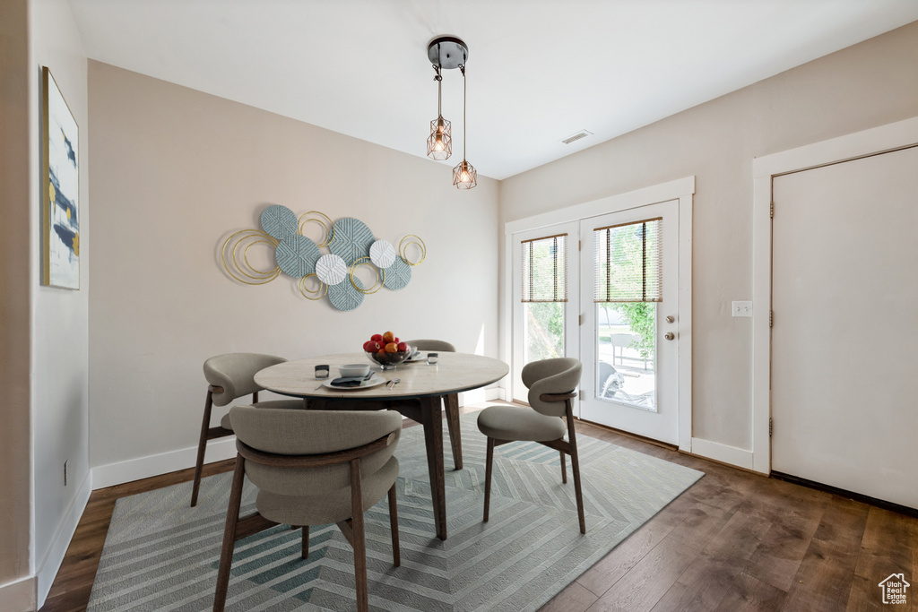Dining room featuring wood finished floors and baseboards