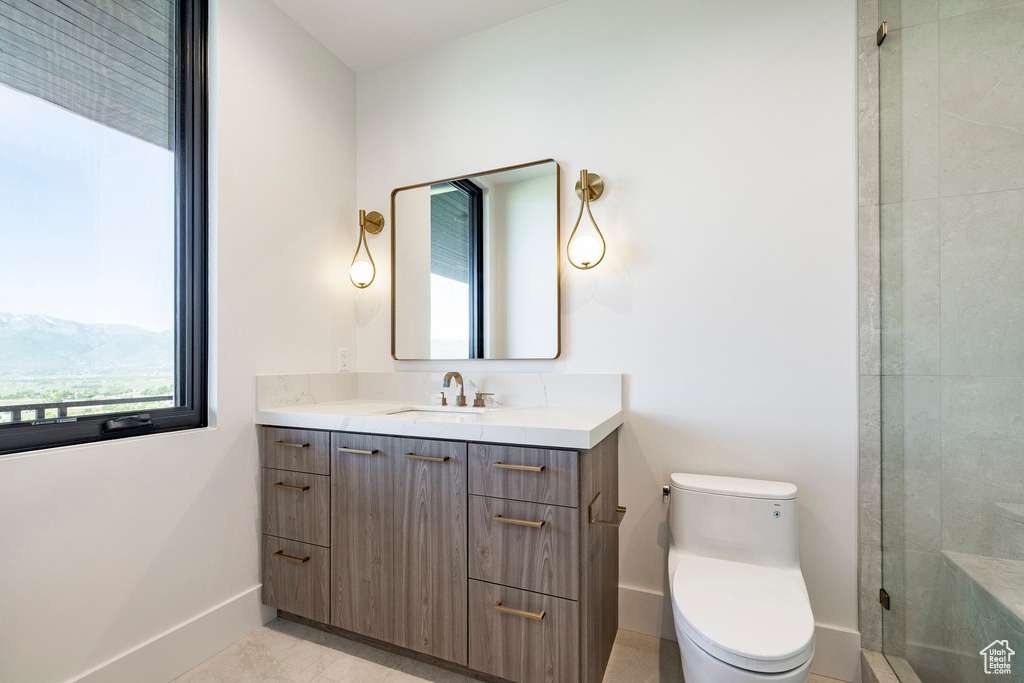 Bathroom with vanity and a shower