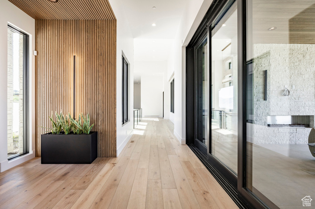 Hall with light wood finished floors