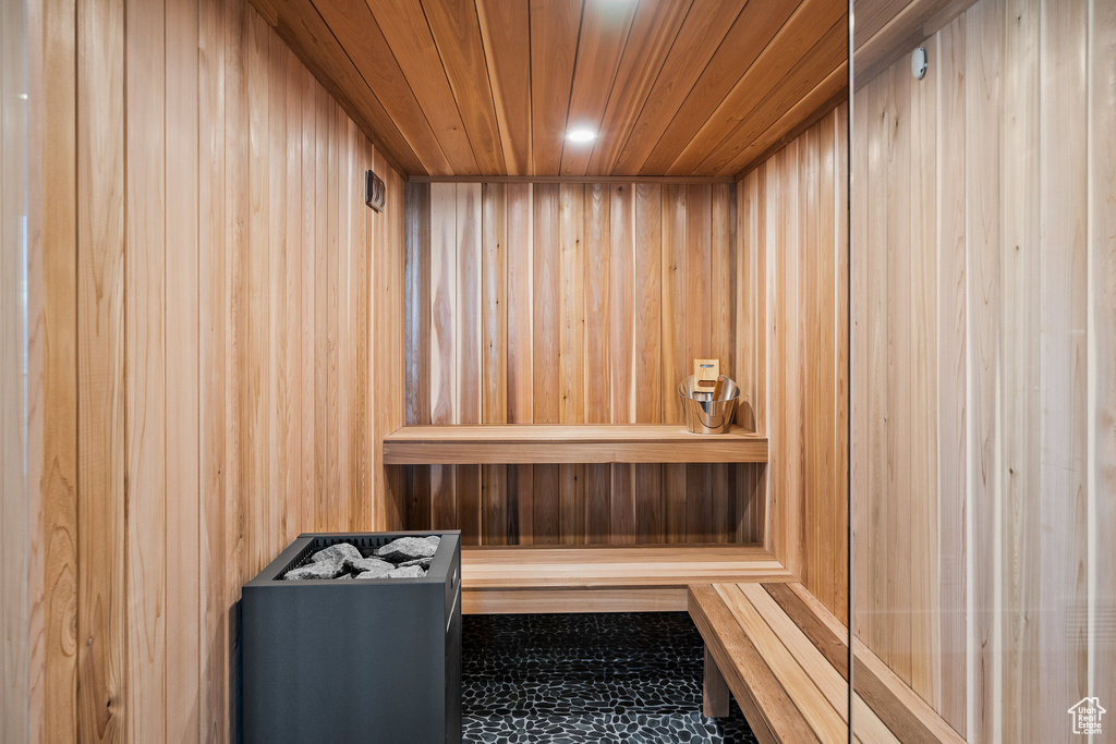 Sauna / steam room featuring wooden walls and wooden ceiling