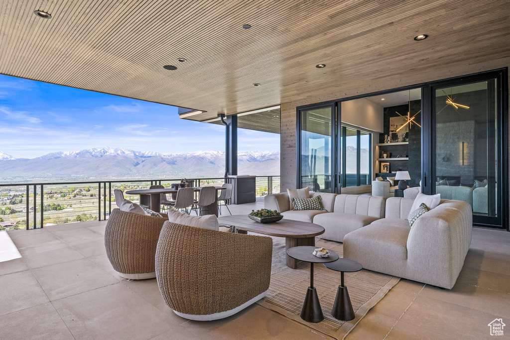 View of patio / terrace featuring a mountain view and an outdoor living space