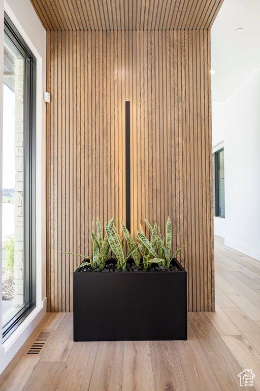 Detailed view of wood finished floors and wooden walls