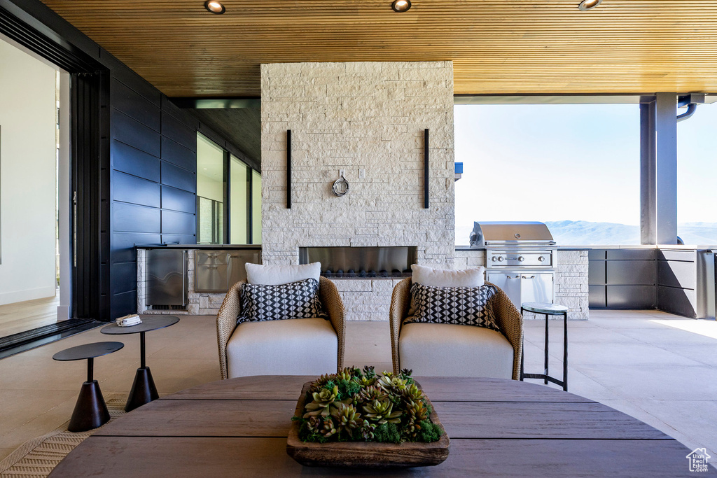 View of patio / terrace with area for grilling and a mountain view