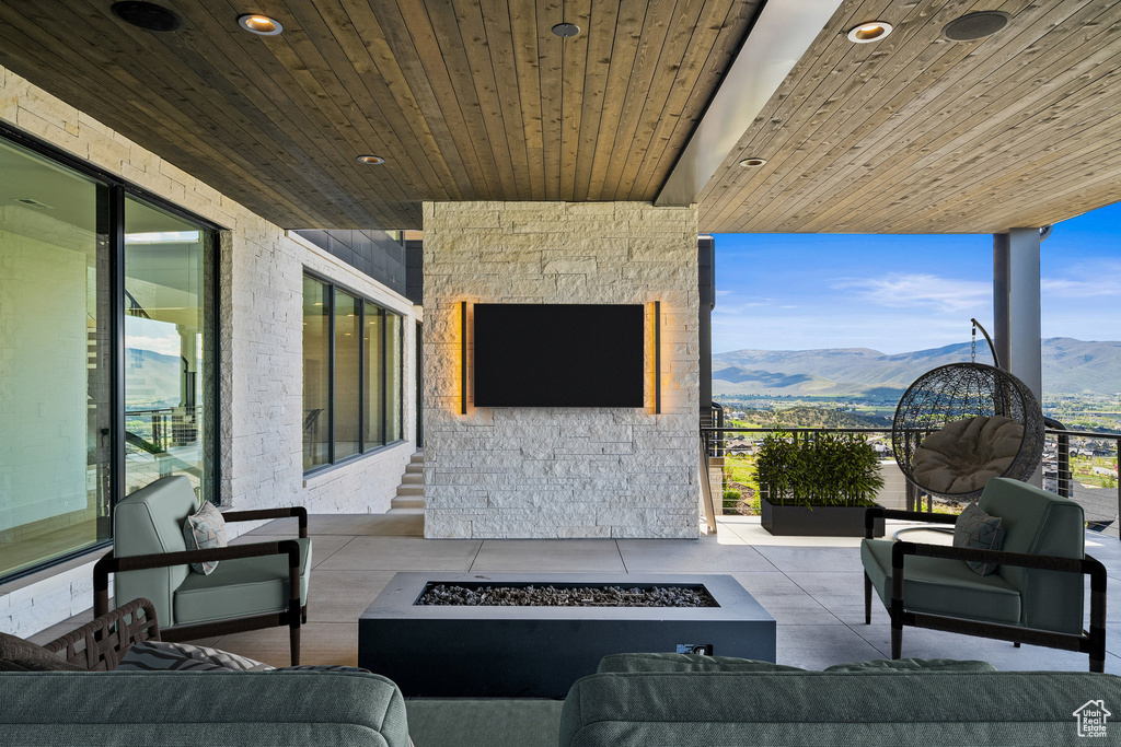 View of patio / terrace with an outdoor living space with a fire pit