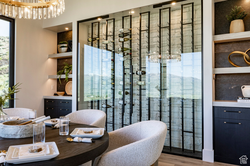 Dining room featuring wood finished floors and a chandelier