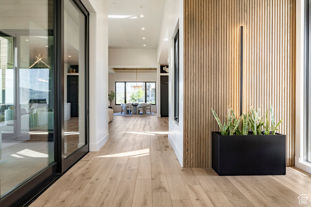 Hall featuring wood finished floors and baseboards