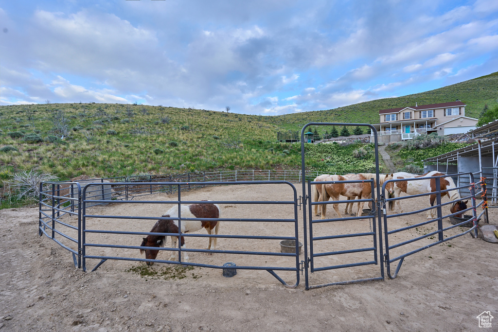Stable featuring a rural view and a mountain view