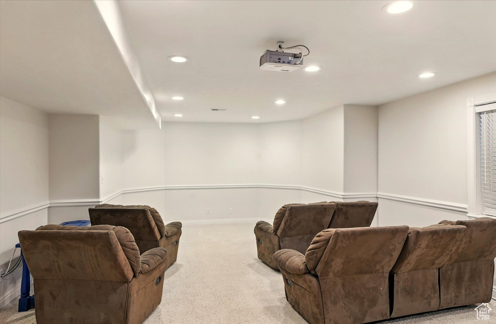 Home theater room with recessed lighting, carpet flooring, and baseboards