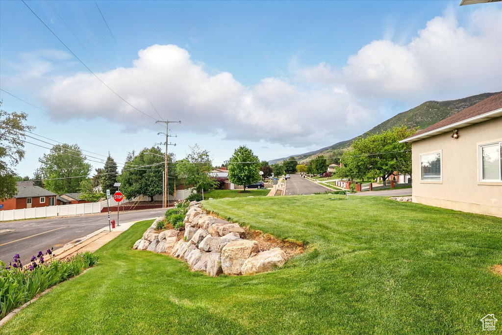 View of green lawn with a mountain view
