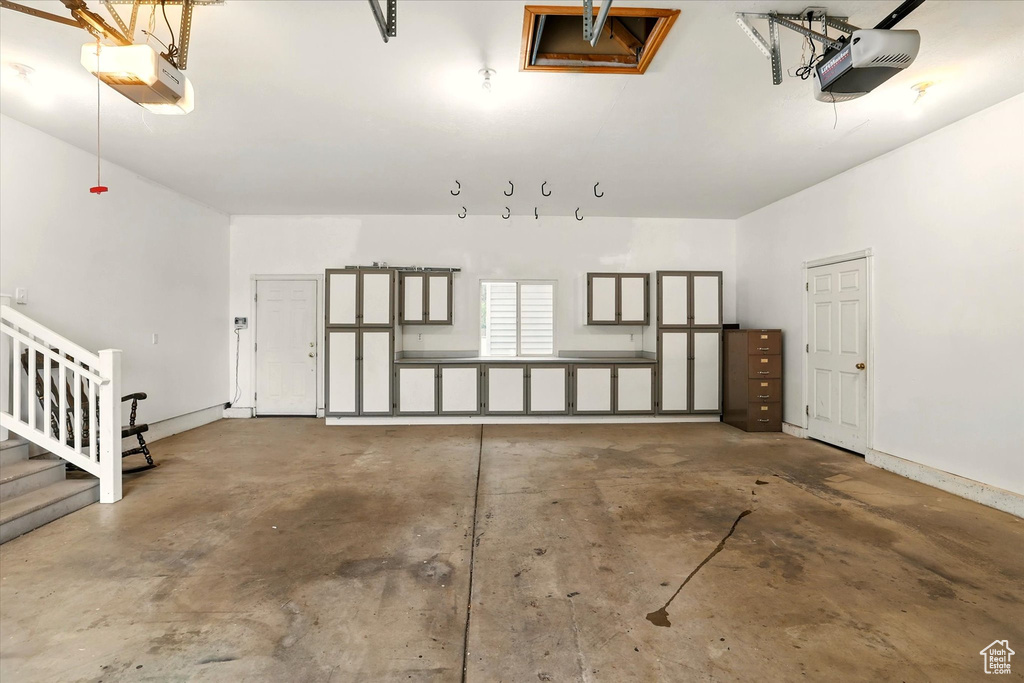 Garage featuring a garage door opener