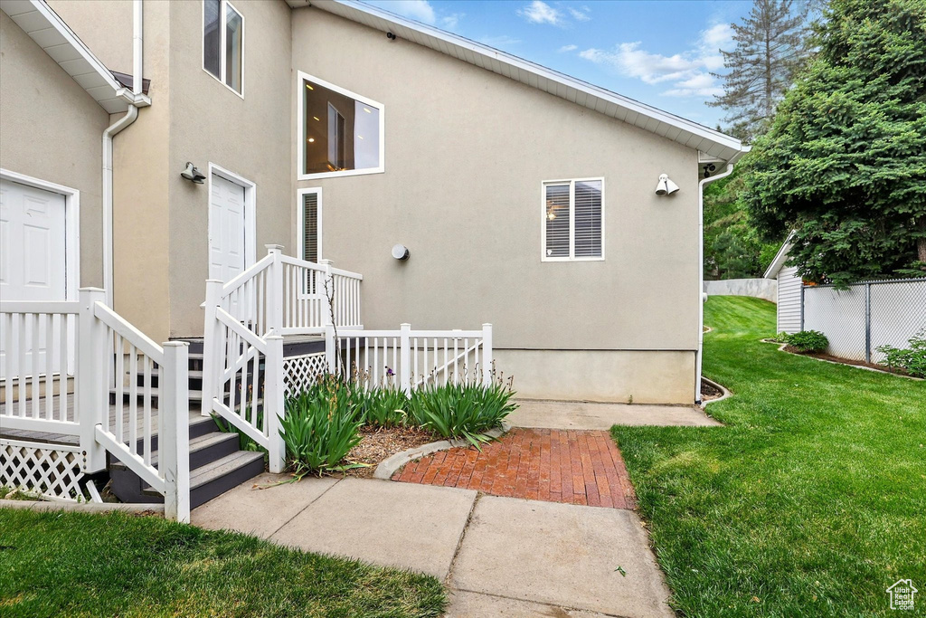 View of side of home featuring stucco siding