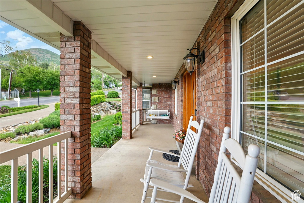 View of patio / terrace with covered porch and a mountain view