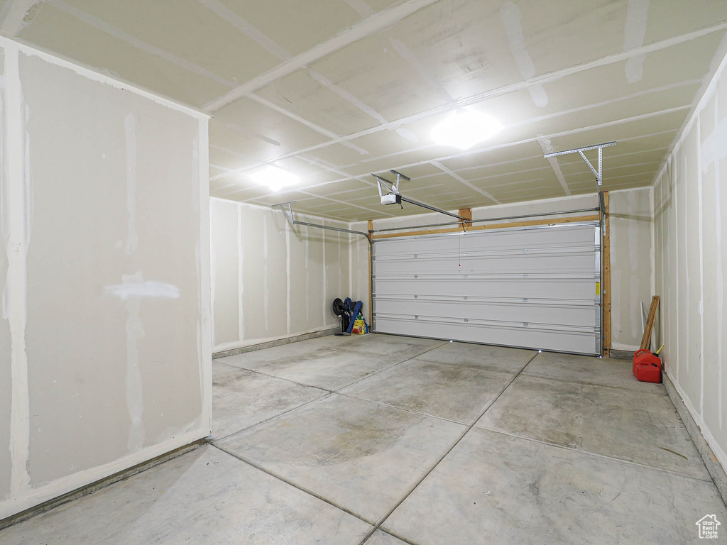 Garage featuring a garage door opener