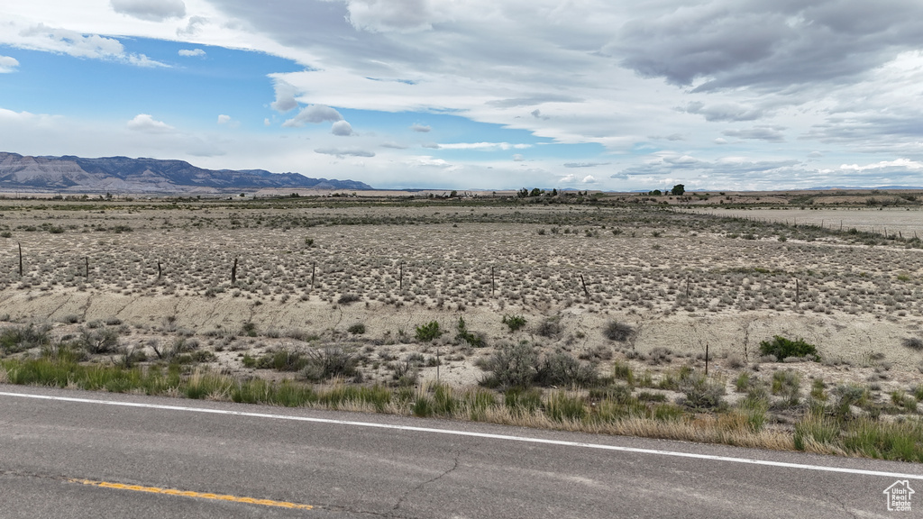 View of mountain background featuring rural landscape