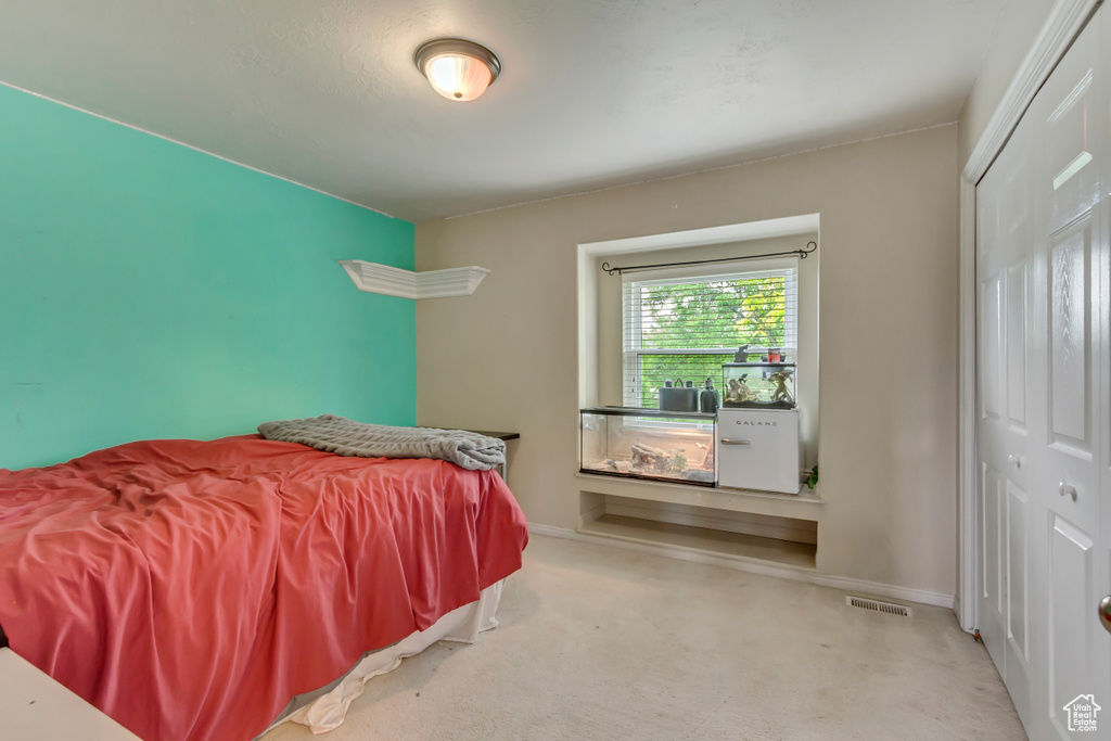 Bedroom featuring a closet and baseboards
