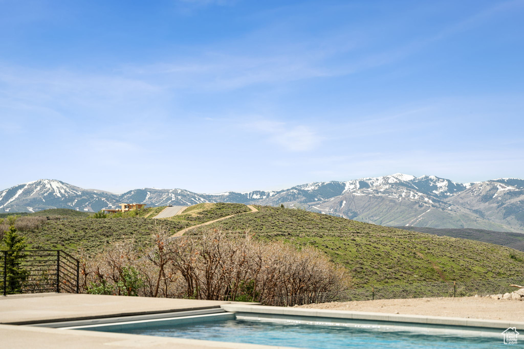 View of swimming pool featuring a mountain view