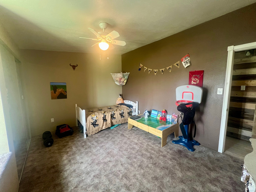 Bedroom with carpet flooring and a ceiling fan