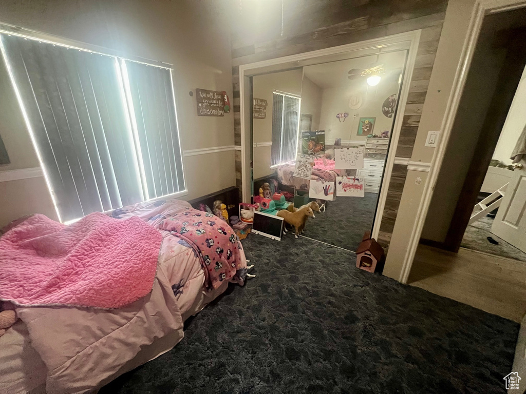 Carpeted bedroom featuring a closet