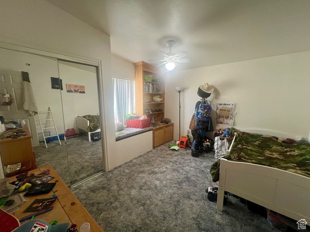 Bedroom featuring carpet, a closet, and a ceiling fan