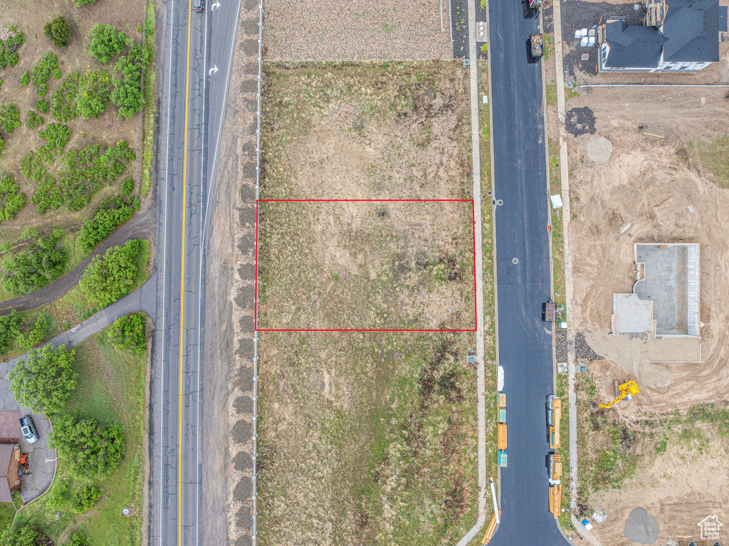 Aerial overview of property\'s location with property parcel outlined