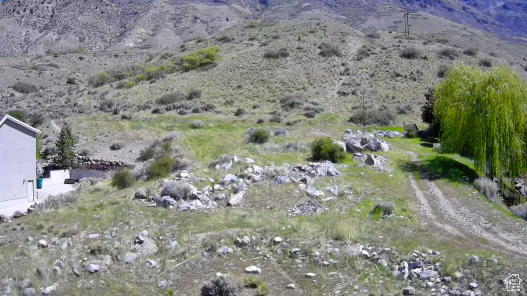 View of mountain backdrop featuring a desert landscape