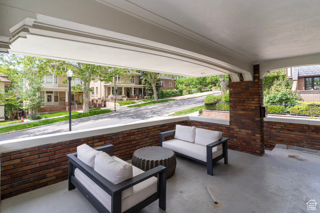 View of patio featuring a porch and a residential view