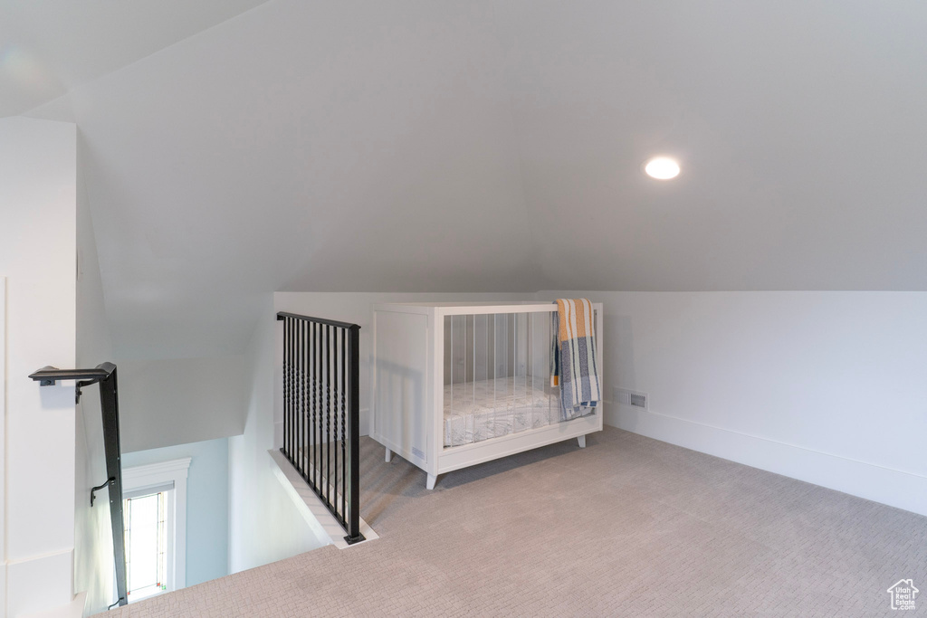 Bonus room featuring lofted ceiling, carpet, and recessed lighting