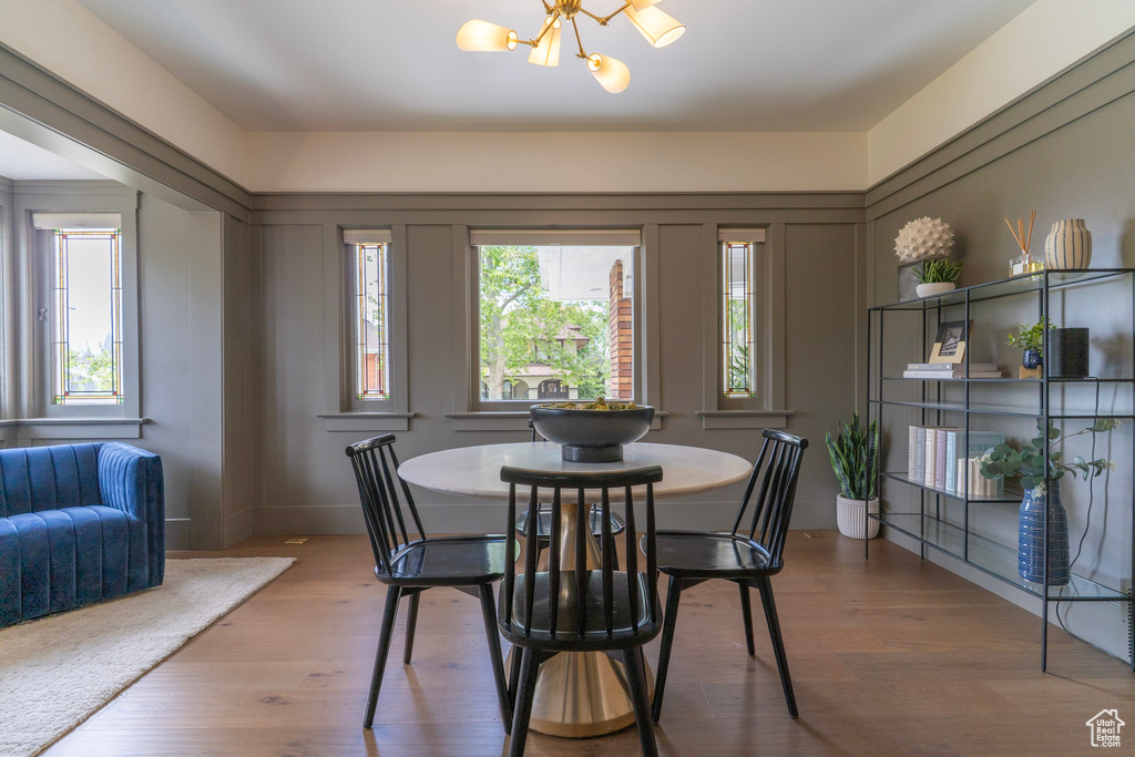 Dining room with a chandelier and wood finished floors