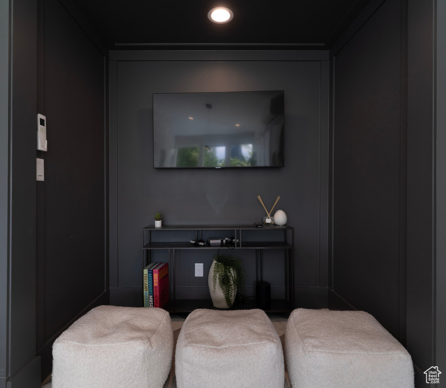 Sitting room featuring recessed lighting and a decorative wall
