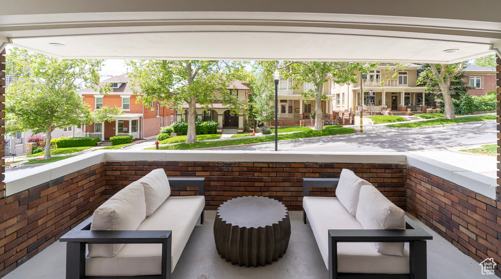 View of patio / terrace with an outdoor living space and a residential view