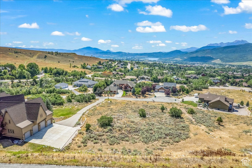 Aerial view of residential area featuring a mountain backdrop