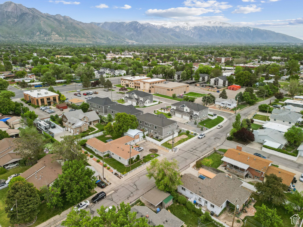 Aerial perspective of suburban area featuring a mountainous background