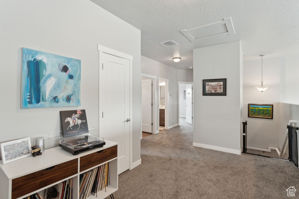 Carpeted office space featuring baseboards