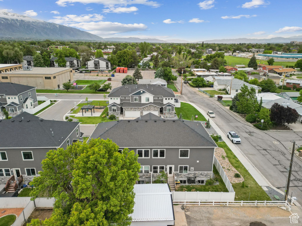 Aerial perspective of suburban area featuring a mountain backdrop