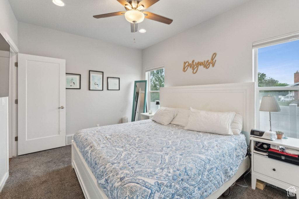 Bedroom featuring dark carpet, recessed lighting, and ceiling fan