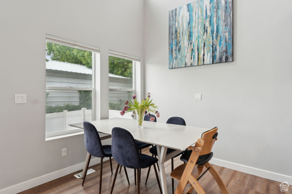 Dining room with baseboards and wood finished floors