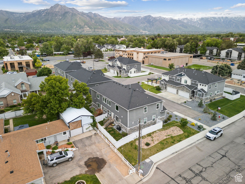 Aerial perspective of suburban area with a mountain backdrop