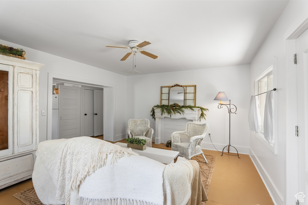 Bedroom with baseboards, a ceiling fan, and a closet