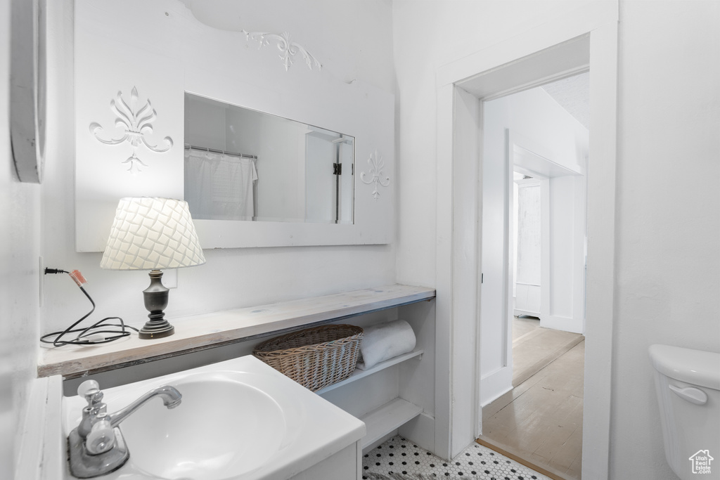 Full bathroom with toilet and vanity